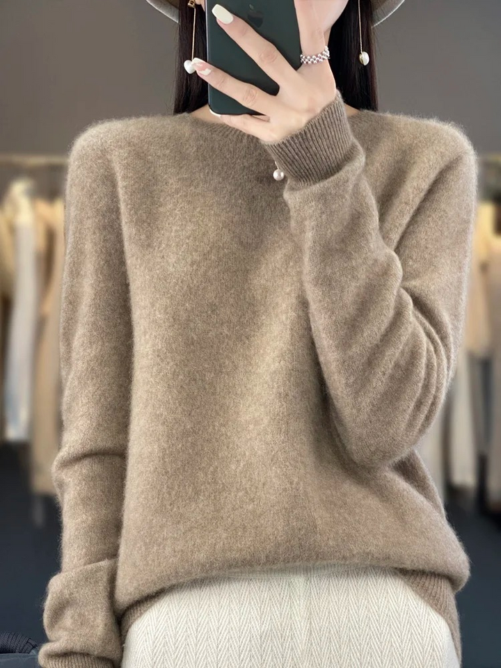 Women's elegant round neck knit sweater, a versatile everyday top for casual comfort.