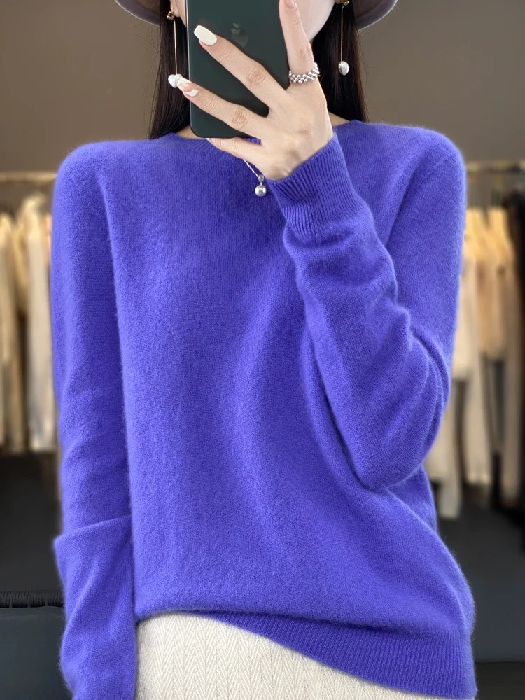 Woman enjoying a cozy moment in a comfortable round neck knit sweater, perfect casual wear.