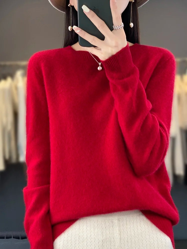 Flat lay of a stylish women's round neck knit sweater, a comfortable fashion staple.