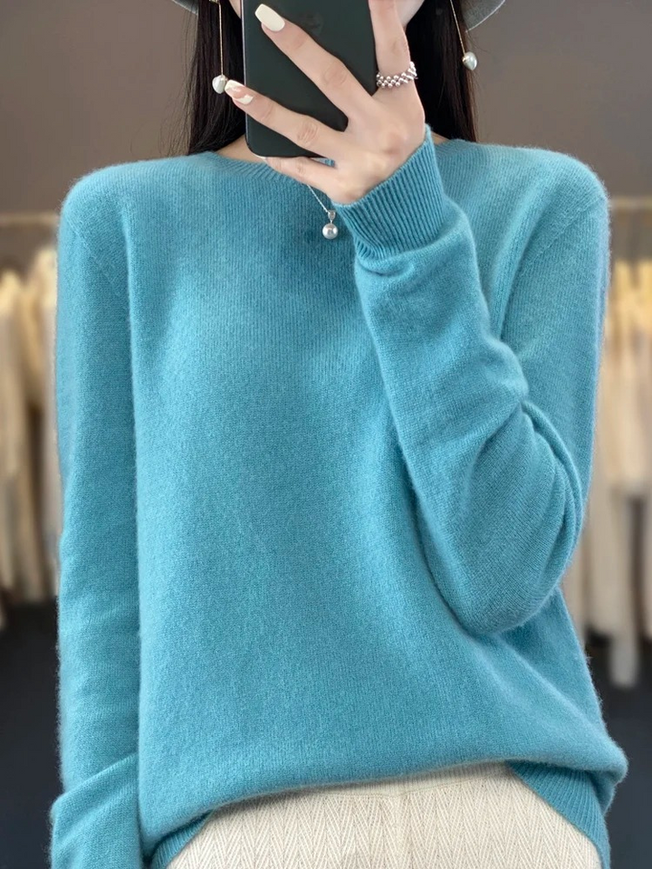 Close-up of soft knit fabric on a women's round neck sweater, comfortable and stylish daily wear.