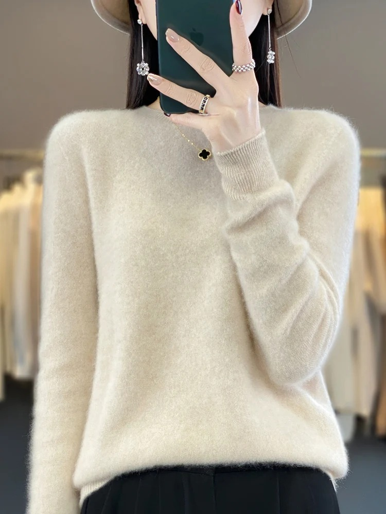 Woman casually styled in a versatile round neck knit sweater, perfect for a chic daily outfit.