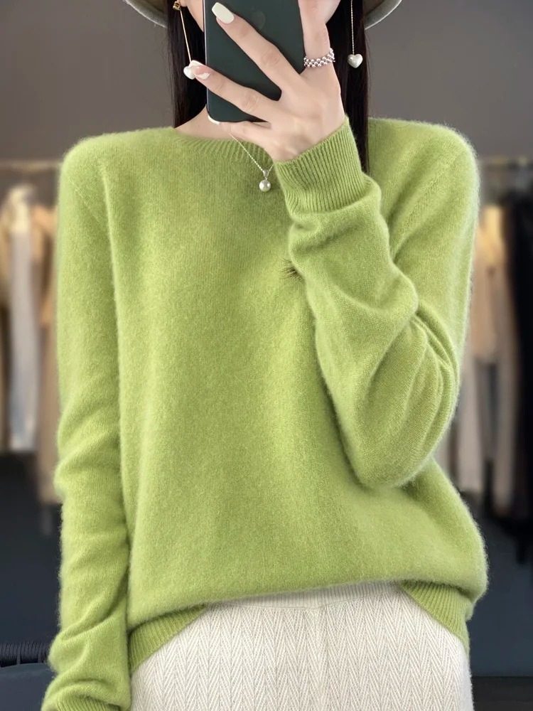 Elegant woman wearing a timeless crew neck knit sweater, a fashion staple for all seasons.