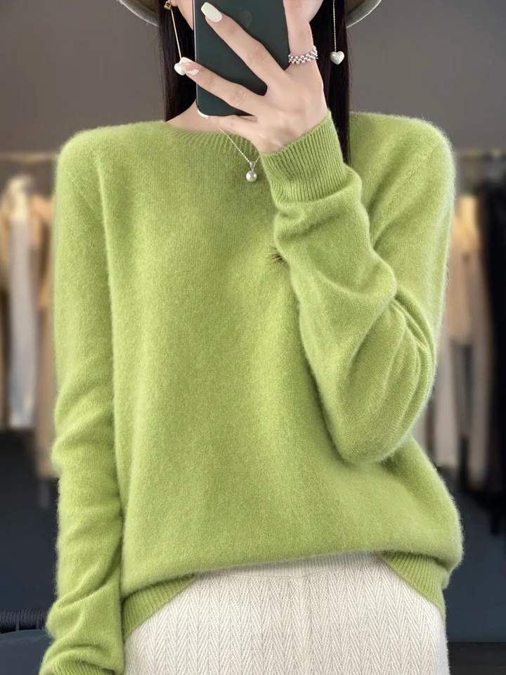 Elegant woman wearing a timeless crew neck knit sweater, a fashion staple for all seasons.