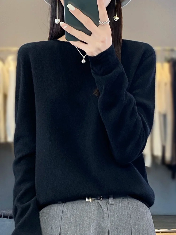 Front view of a women's classic round neck knit sweater, an elegant and comfortable daily top.
