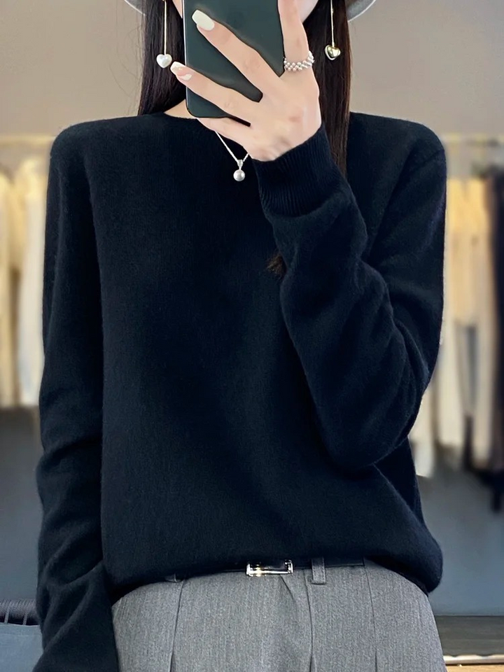 Front view of a women's classic round neck knit sweater, an elegant and comfortable daily top.