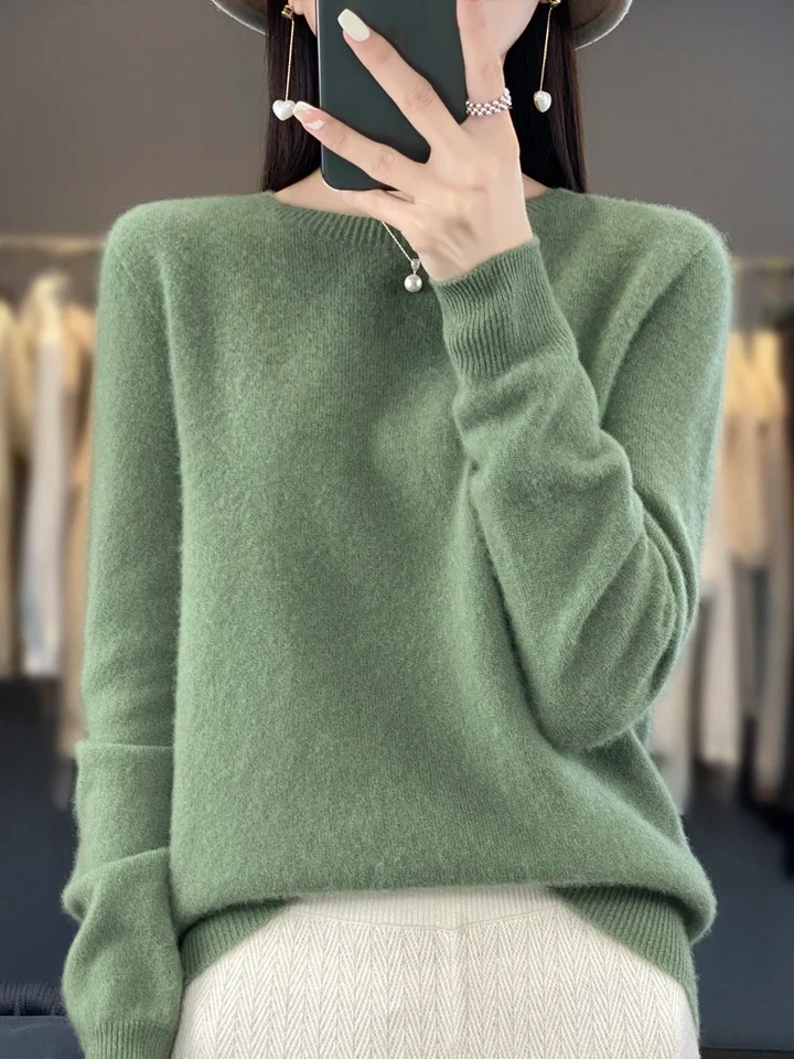 Back view of a comfortable women's knit sweater with a flattering round neckline, casual staple.