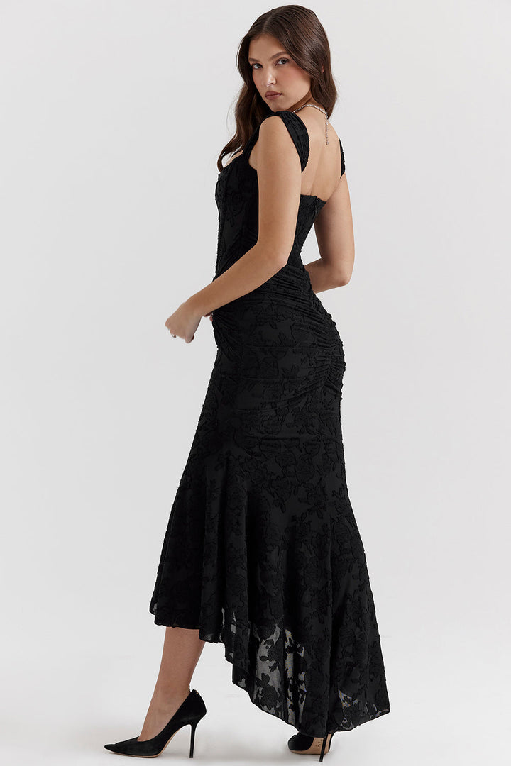 Chic ruched bodice maxi dress with flowing skirt, perfect for a wedding guest or evening party.