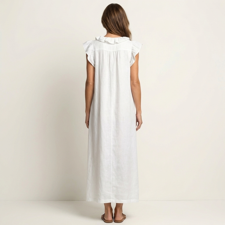 Woman confidently wearing elegant ruffle V-neck maxi dress, showcasing its chic appeal for summer days.