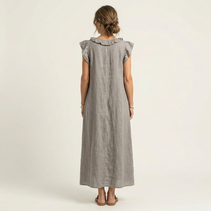 Close-up of elegant women's ruffle V-neck maxi dress, showcasing flattering neckline details for summer.