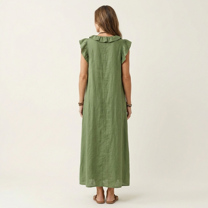 Woman wearing elegant ruffle V-neck maxi dress outdoors, perfect for a stylish summer day or holiday look.