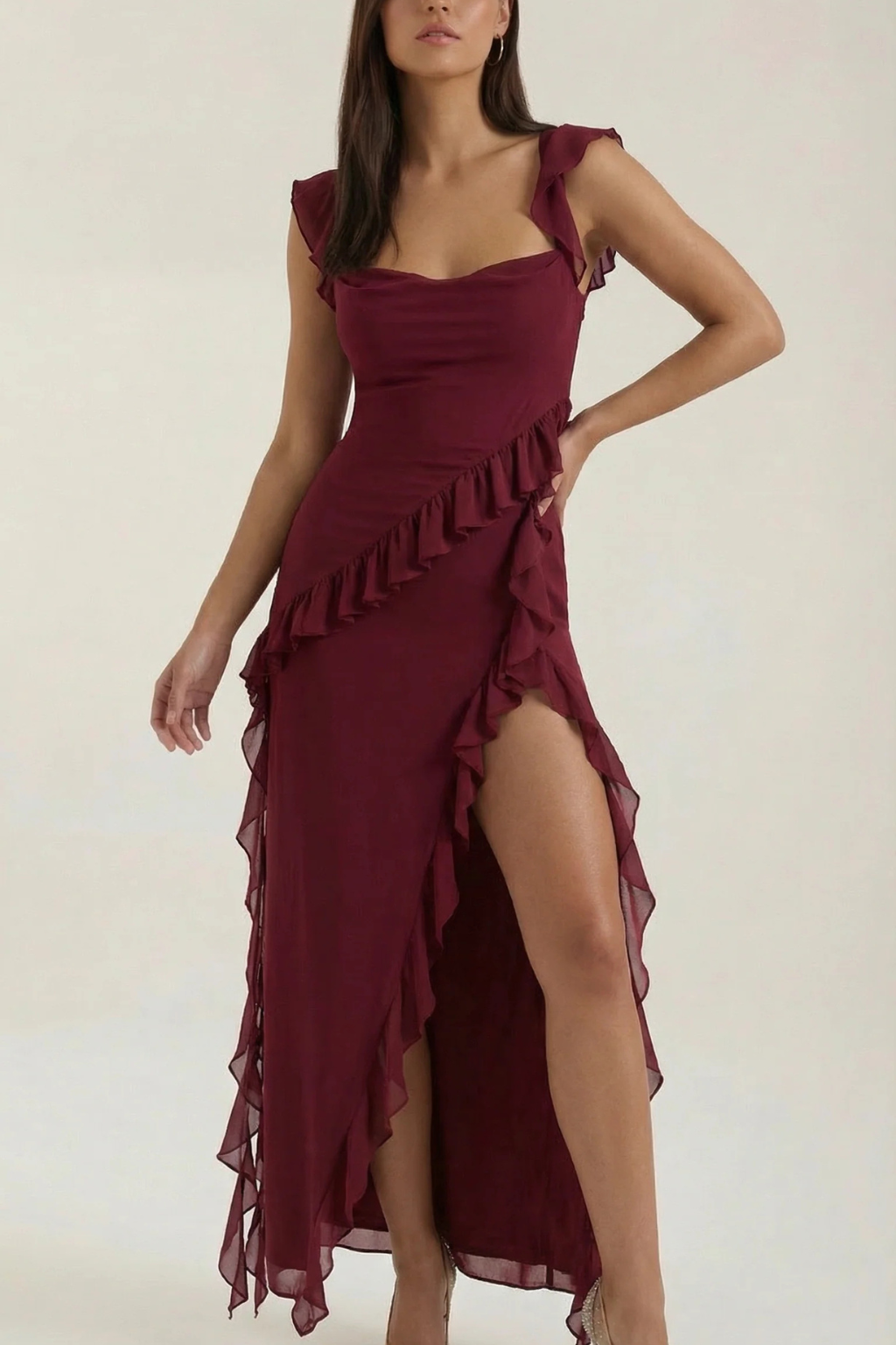 Elegant women's graduation outfit: a ruffled dress with a chic side slit for ceremonies.