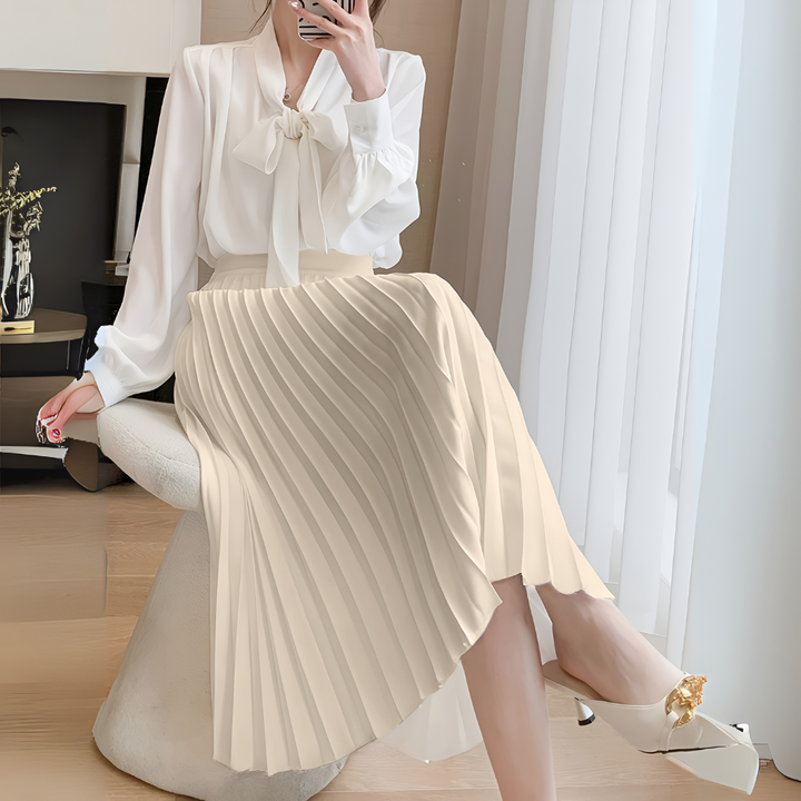 Flowy high-waist pleated skirt in luxurious satin fabric for women.