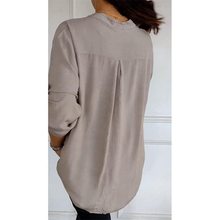 Elegant women's button-up blouse, featuring stylish sequin trim for a sophisticated look.