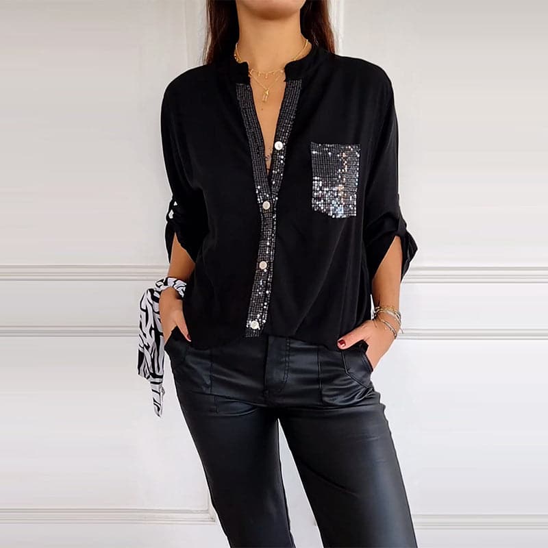Chic women's button-up blouse with sparkling sequin detailing for a glamorous look.