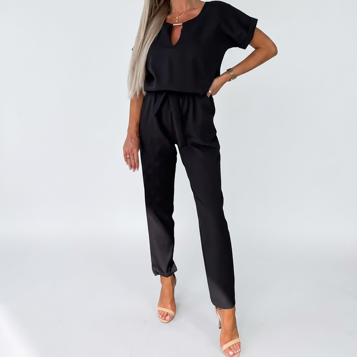 Chic women's short-sleeve keyhole jumpsuit for versatile fashion. Ideal for office wear or a sophisticated dinner outfit.