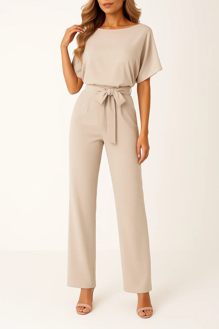 Fashionable women's wide leg jumpsuit with short sleeves & a flattering tie waist. Elegant & comfortable.