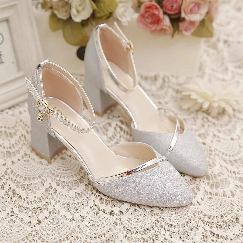 Chic black dress shoes for women featuring a comfortable block heel and stylish ankle strap.