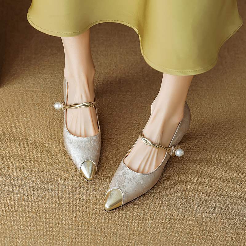 Stylish women's slingback heels, pearl ankle strap, pointed cap toe. Essential for fashion footwear.