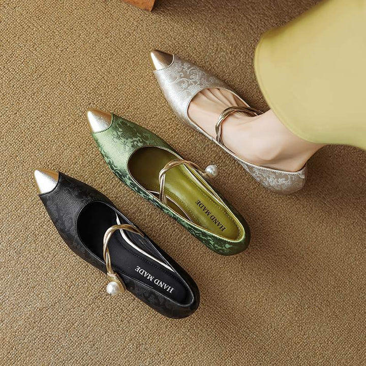 Women's elegant slingback heels, pearl strap, pointed cap toe, perfect formal eveningwear.