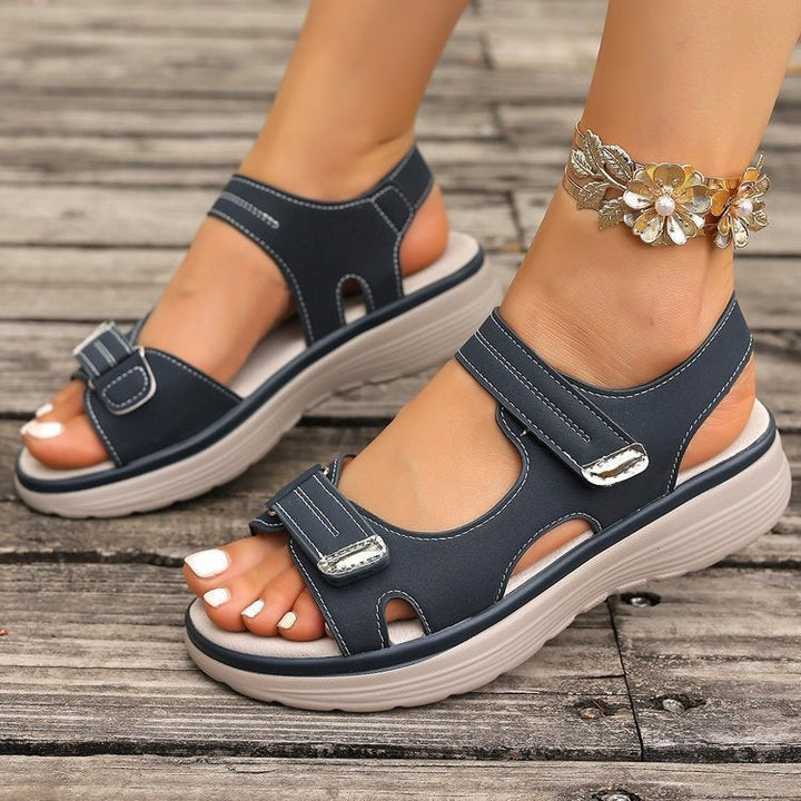 Women's elegant slip-on flat sandals for summer comfort and casual wear.
