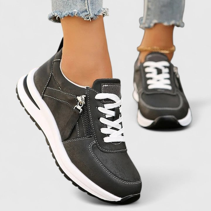 Fashionable women's slip-on sneakers with ergonomic arch support for superior comfort & style.