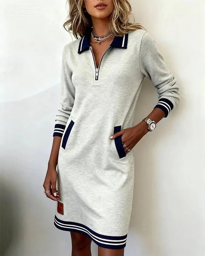 Women's everyday midi dress with practical side pockets, long sleeves, and a chic zip-front collar.