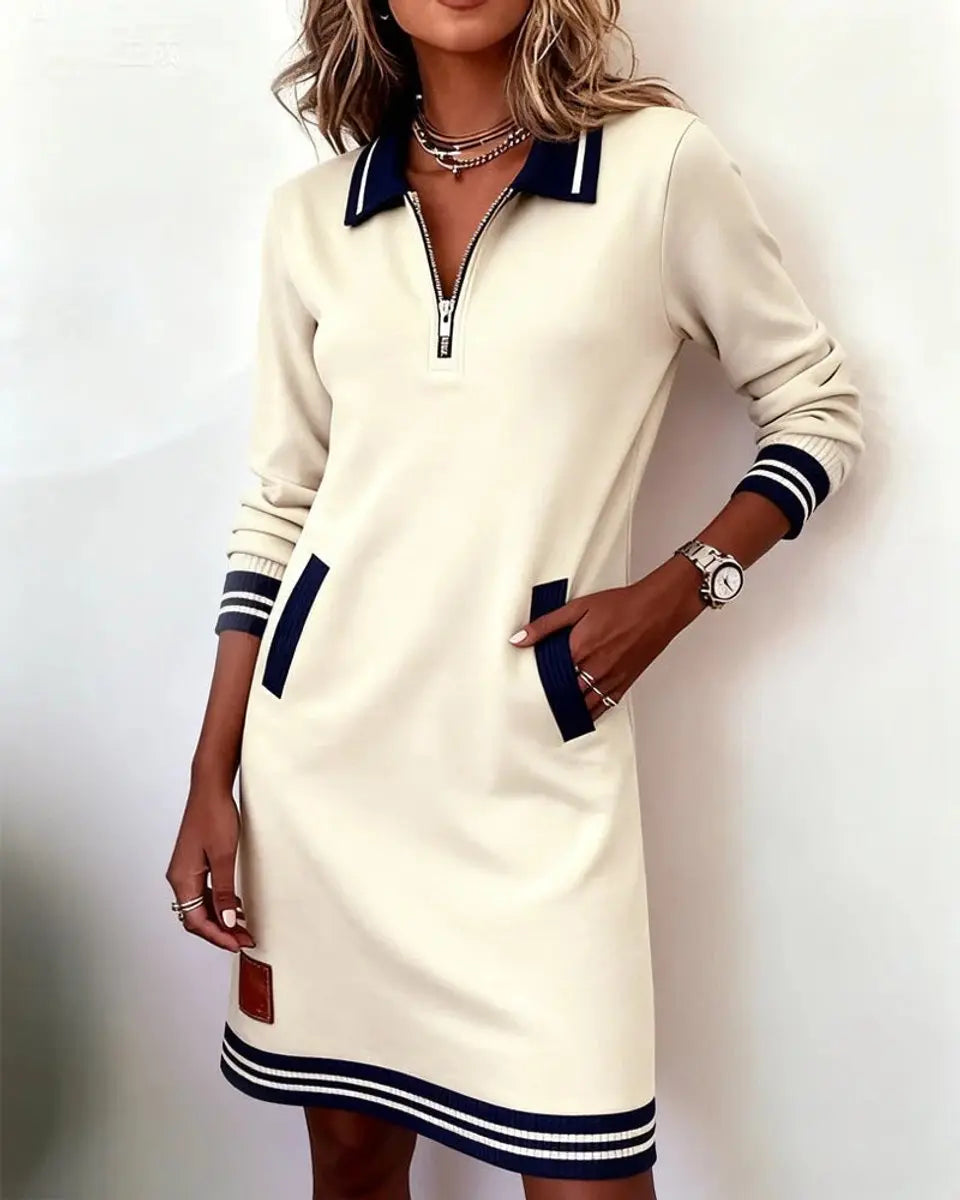 Women's fall fashion midi dress, long sleeve, zip collar, featuring subtle striped details & pockets.