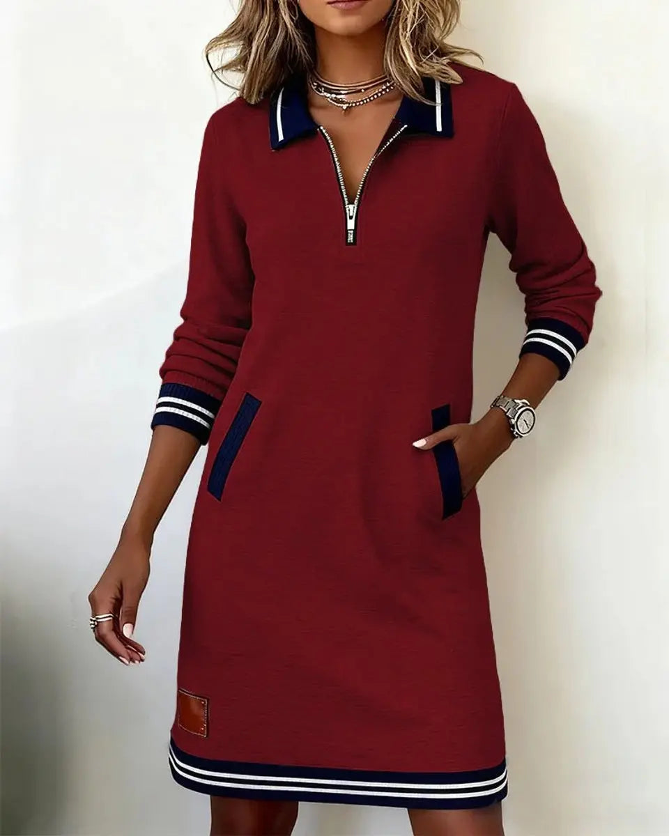 Chic smart casual women's midi dress, long sleeve, zip collar, striped details, and side pockets.