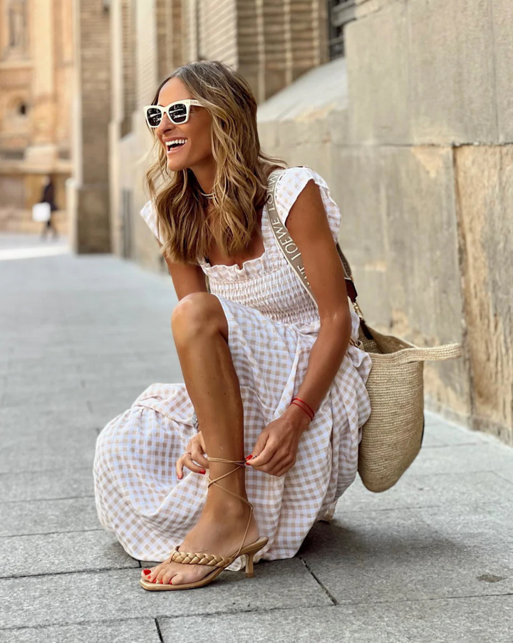 Smocked bodice maxi dress for women, ideal for beach vacations or elegant summer events. Comfortable fit.