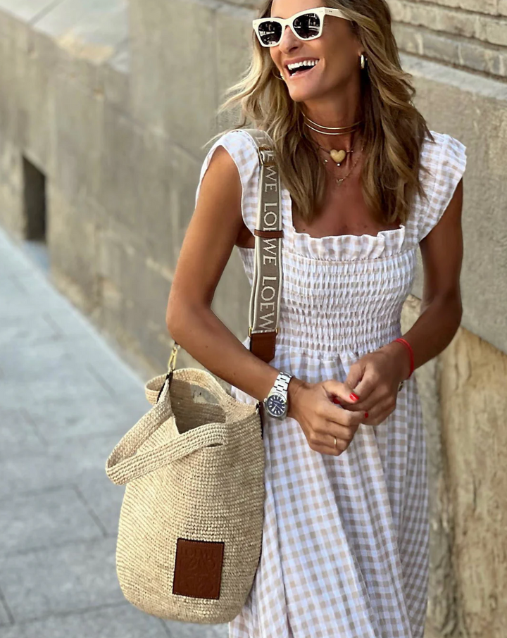 Comfortable smocked maxi dress for women, featuring a flattering silhouette, perfect for versatile event wear.