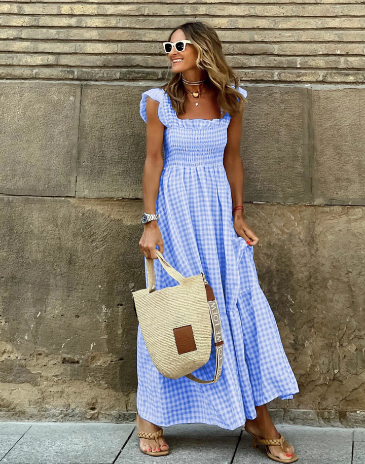 Elegant yet casual women's smocked maxi dress, ideal for summer, vacation, or comfortable daily wear.