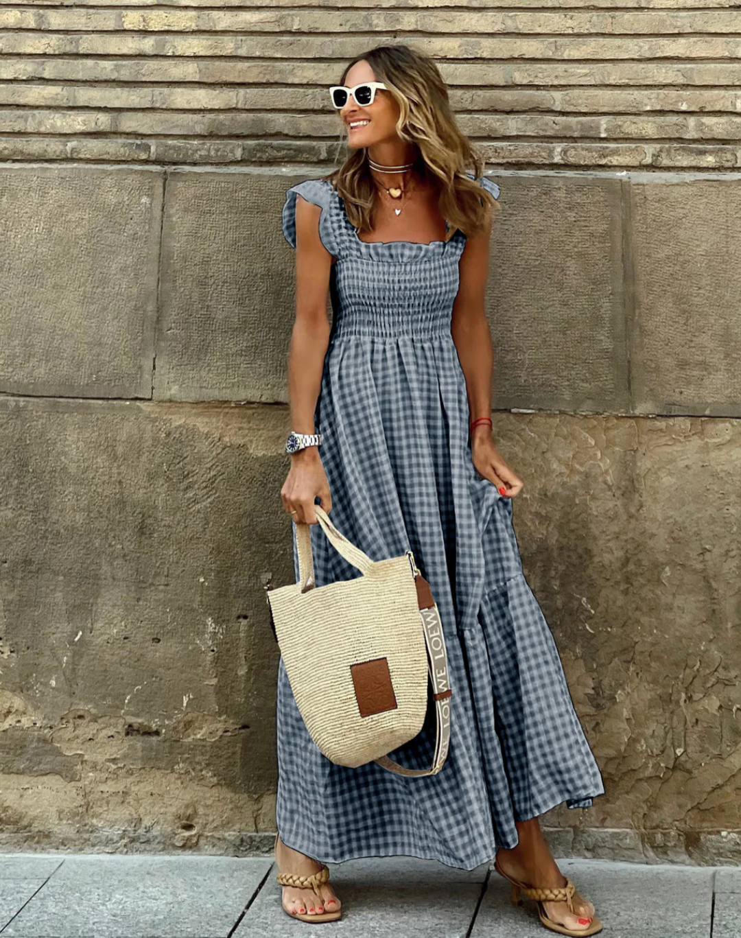 Lightweight women's smocked maxi dress, a comfortable and stylish choice for warm summer days and vacations.
