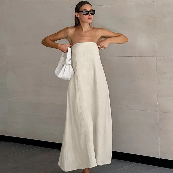 Women's elegant strapless maxi dress, perfect for summer, holidays, or day-to-night wear. Flowy, minimalist.