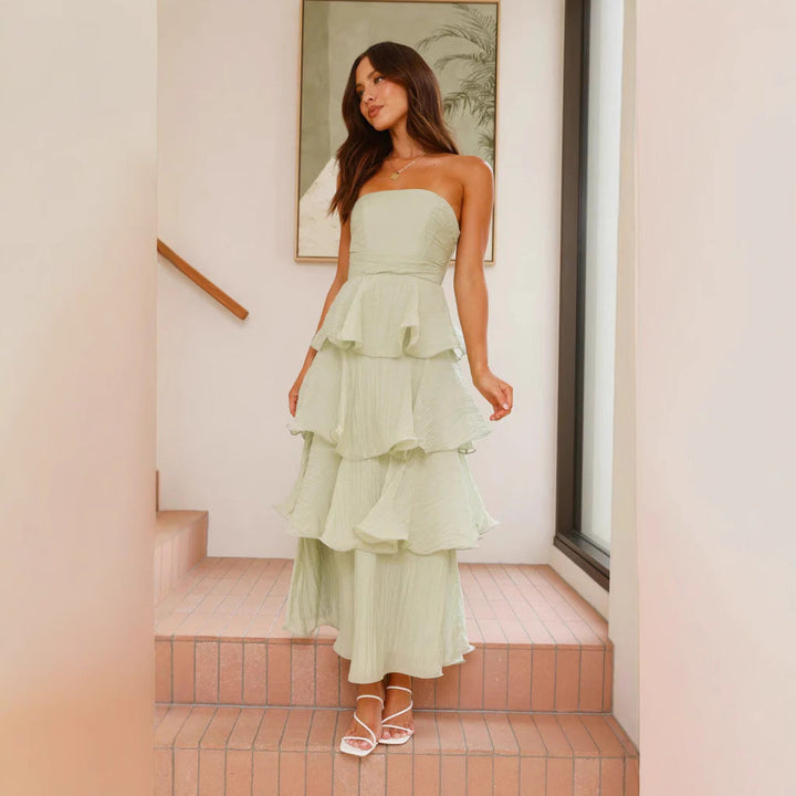 Chic strapless tiered ruffle maxi dress for women, ideal for formal summer weddings.