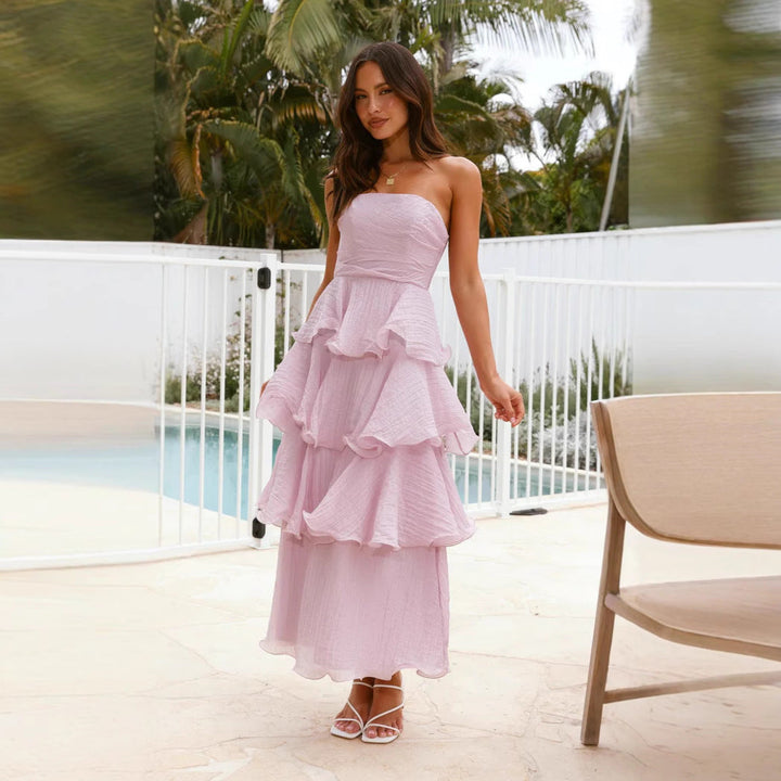 Formal women's strapless maxi dress with tiered ruffles, suitable for special occasions.