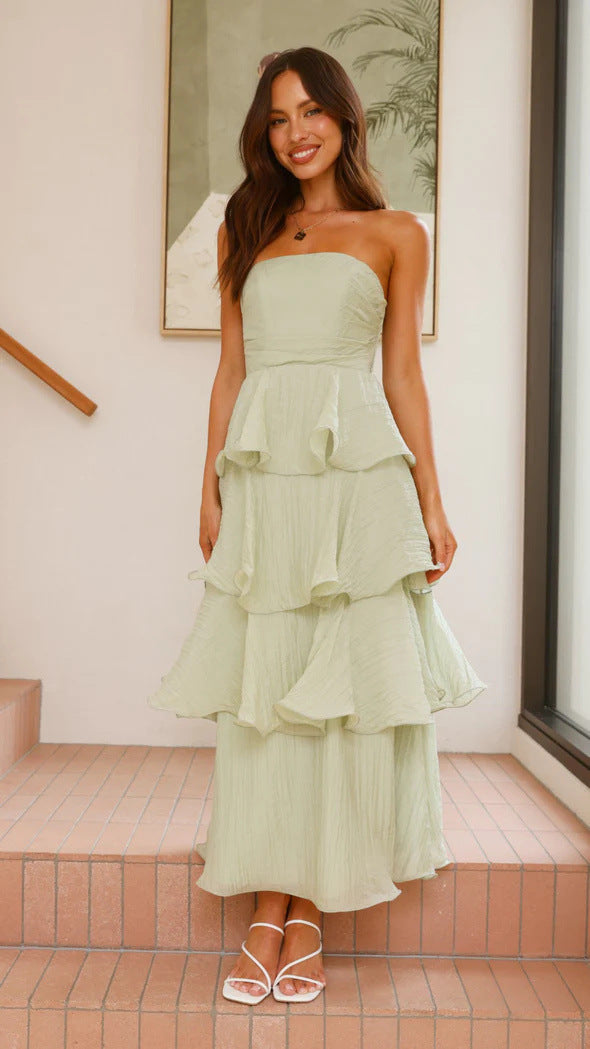Women's strapless maxi dress with delicate tiered ruffles, a chic formal occasion outfit.