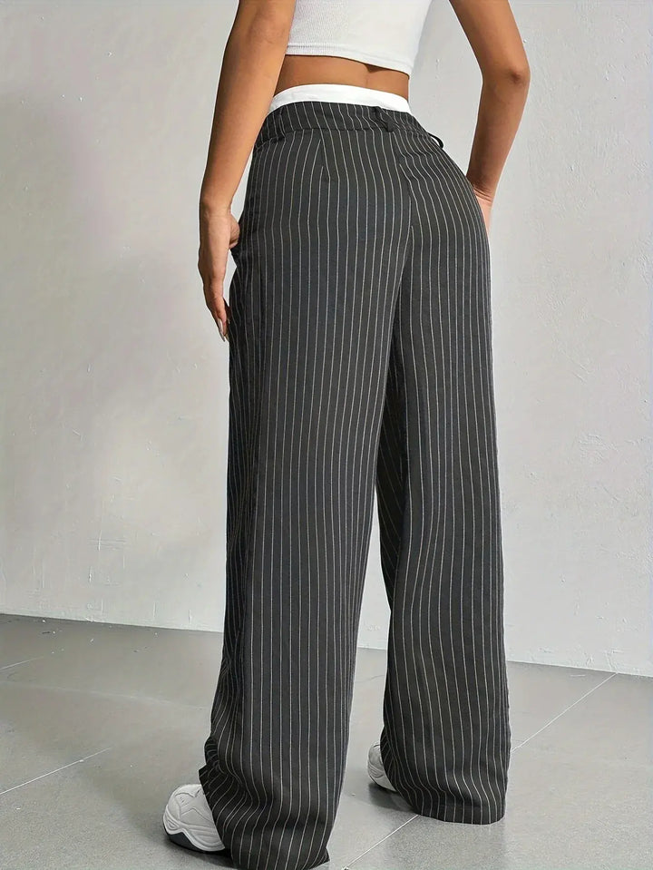 High-waisted wide leg striped trousers for women, offering elegant comfort for office or stylish casual wear.