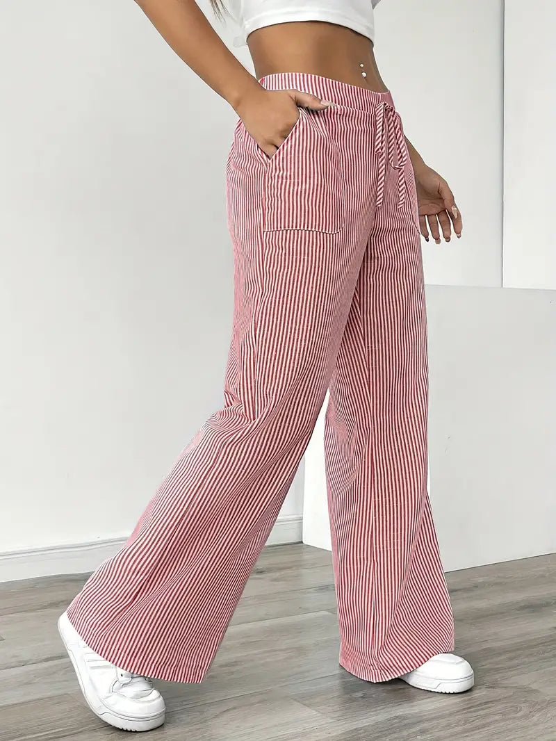 Elegant striped wide-leg pants for women, featuring practical pockets for comfort.