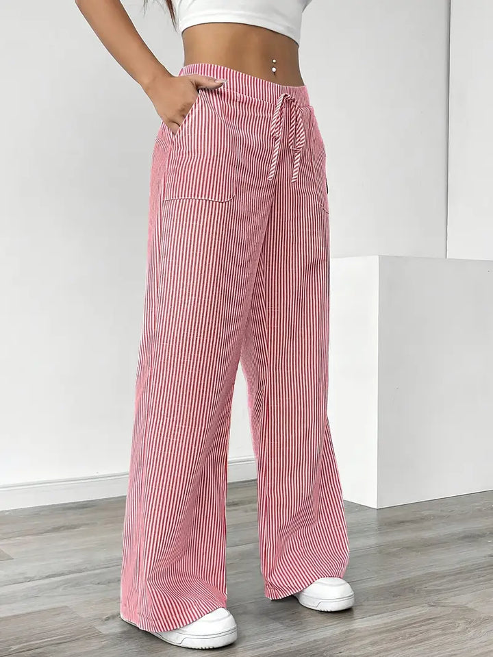 Stylish pink striped wide-leg pants for women, ideal for a chic summer outfit.