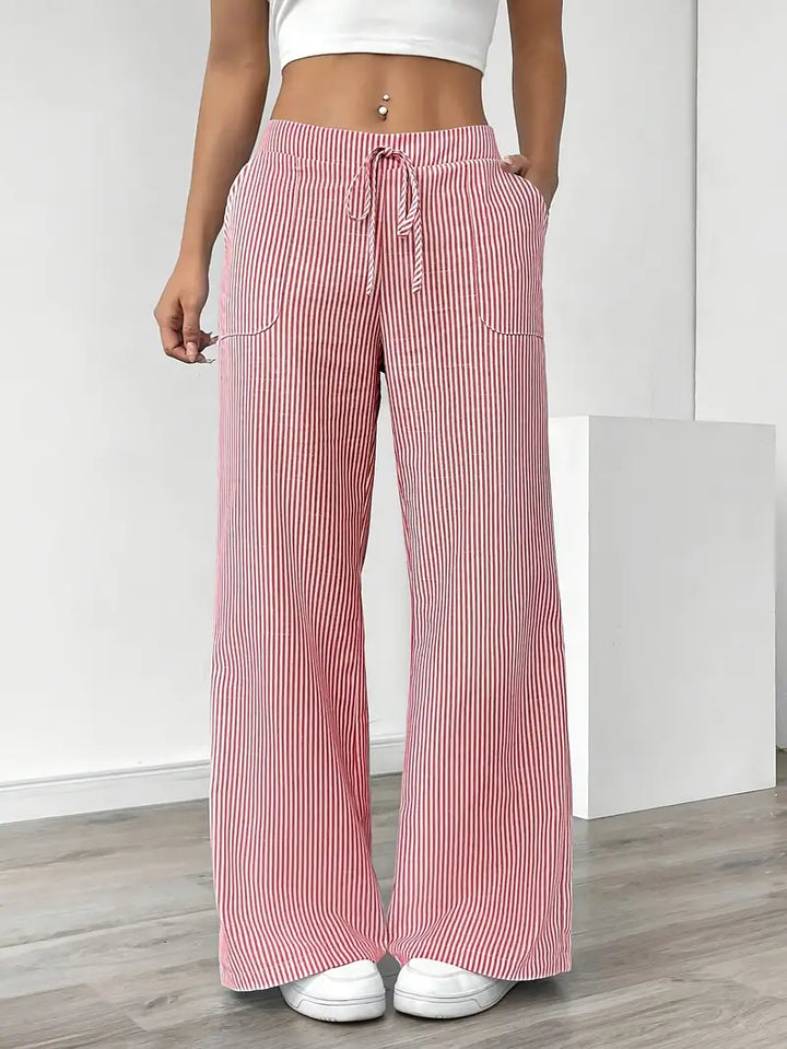 Comfortable yellow striped wide-leg pants for women, ideal for summer style.