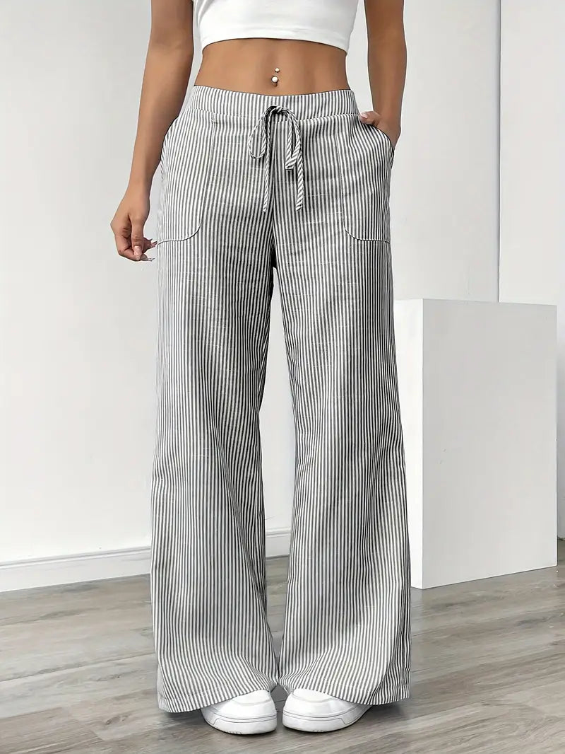 Blue striped wide-leg women's pants with convenient pockets for everyday comfort.