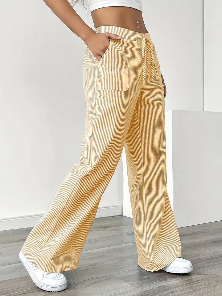 Yellow striped wide-leg pants, women's comfortable casual wear with pockets.