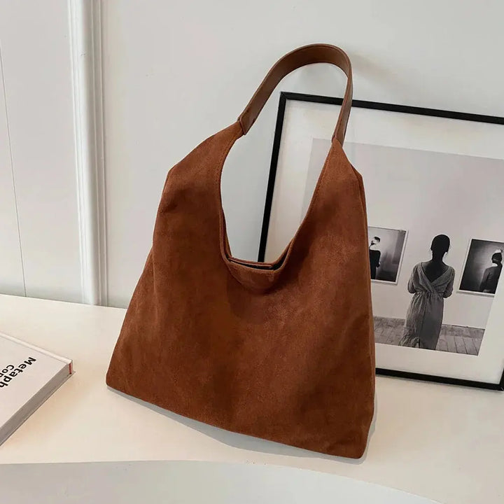 Women's elegant suede tote bag, perfect for shoulder carry.