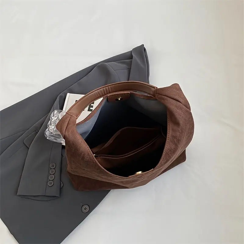 Fashionable women's suede tote bag, an elegant shoulder handbag for modern style.