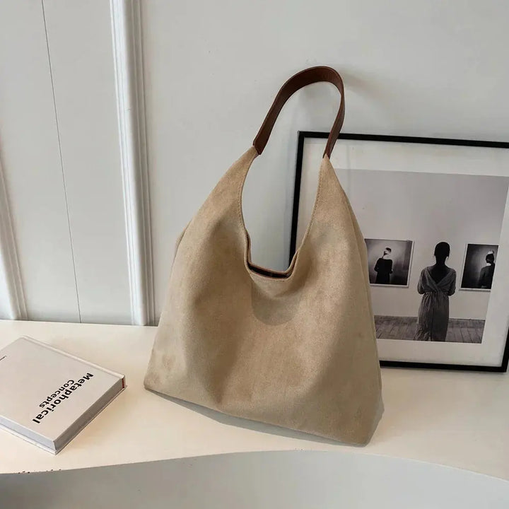 Elegant women's suede tote handbag, a sophisticated fashion statement.