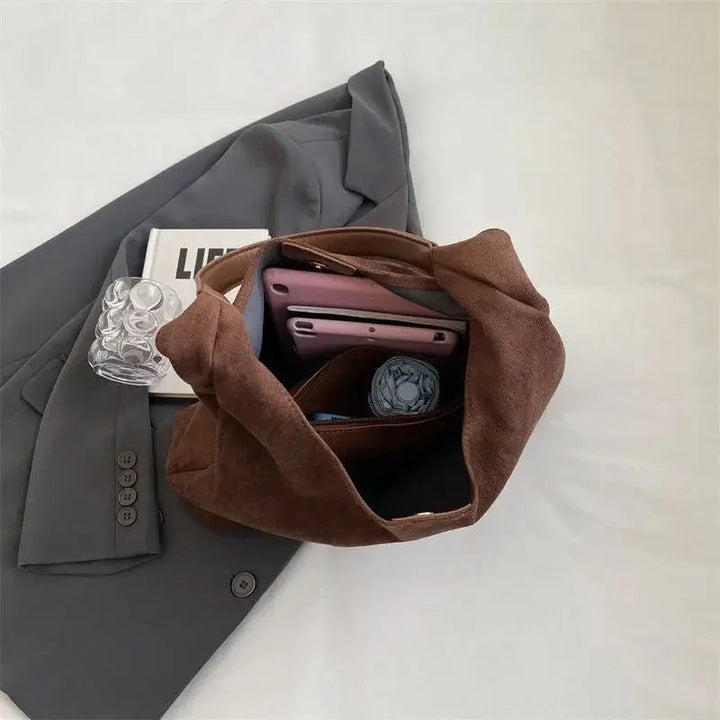 Versatile women's suede tote, an essential elegant everyday shoulder handbag.