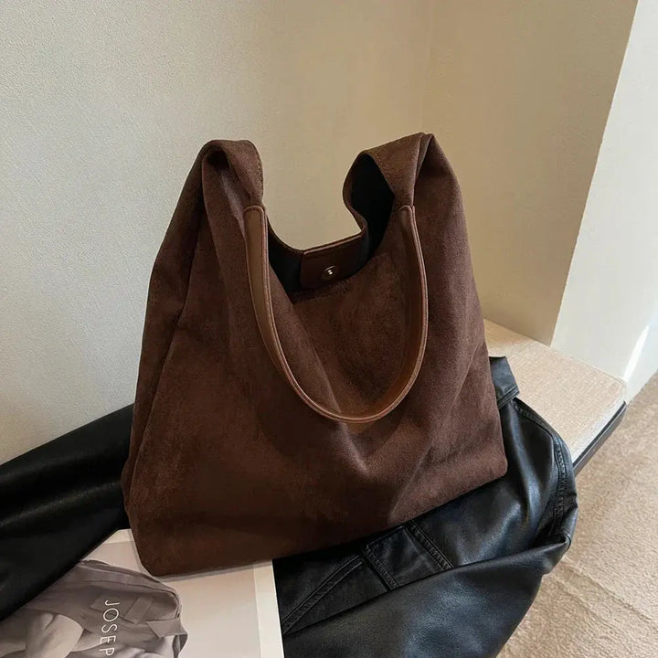Luxury women's suede shoulder bag, stylish and practical tote for any outfit.