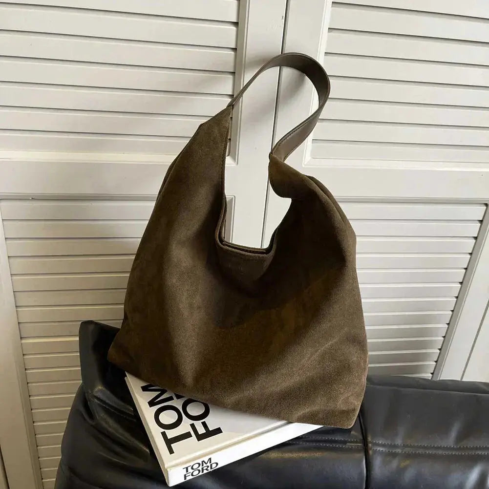 Chic minimalist suede tote for women, an elegant shoulder handbag accessory.