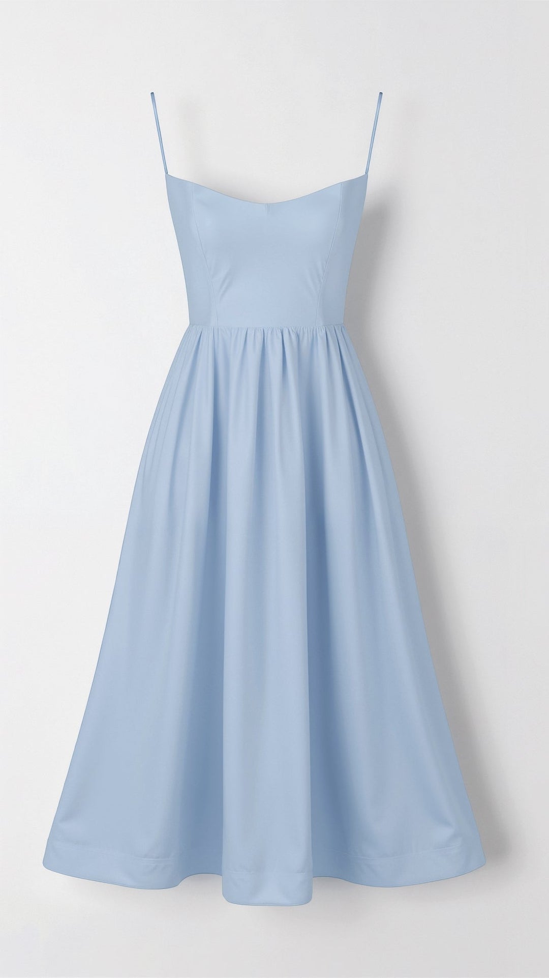 Stylish women's party midi dress with a sweetheart neck, thin straps, and a graceful flowy skirt.