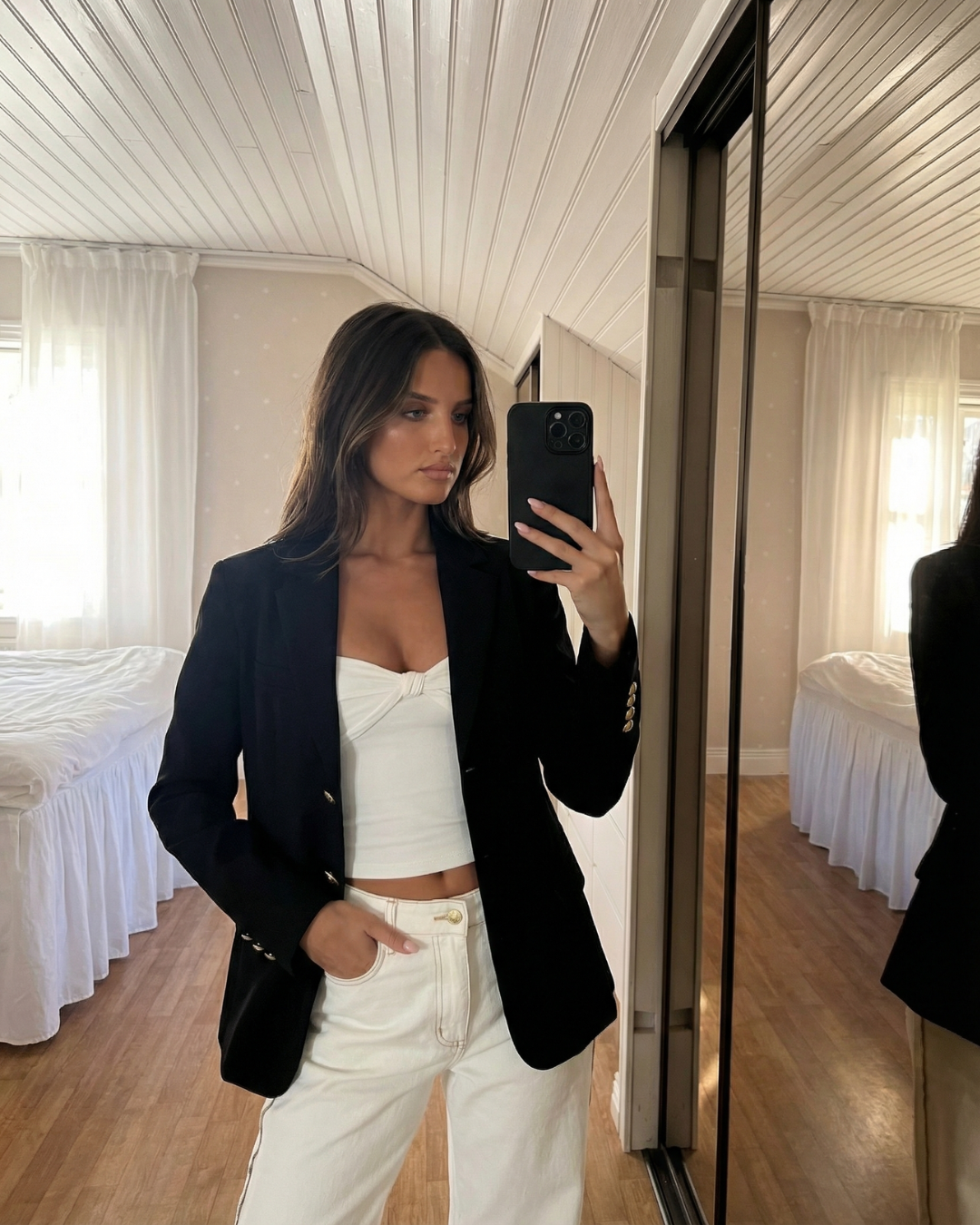 Structured women's tailored jacket featuring classic gold button details, ideal for smart casual or office fashion.